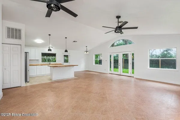 a view of a kitchen with a sink and a window