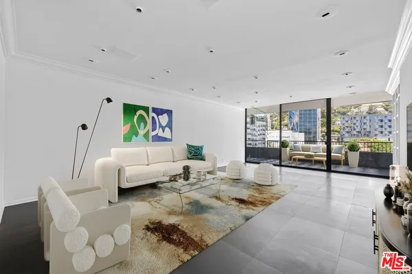 an empty room with sliding glass door and shower