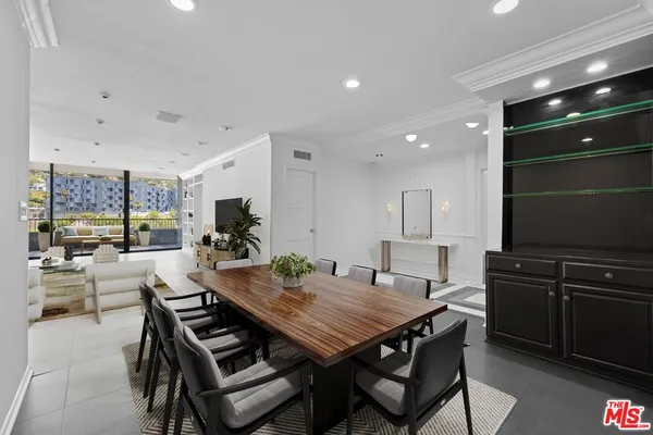 a kitchen with white cabinets stainless steel appliances and sink