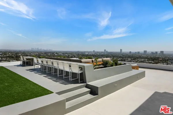 a view of a terrace with city view