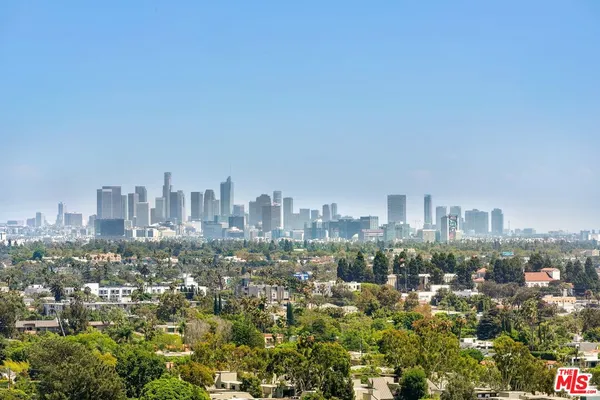 a view of a city with tall buildings