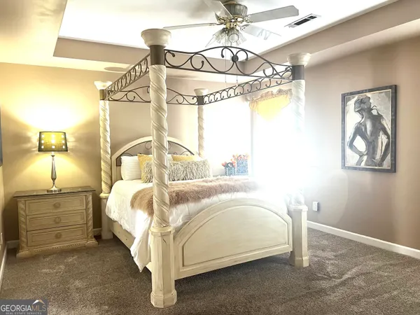 a bedroom with a bed and a cabinets