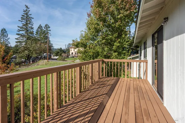 a view of balcony with wooden floor
