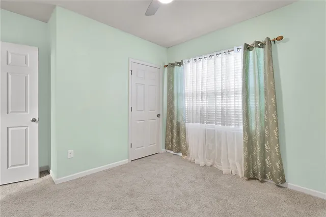 an empty room that has a window in it