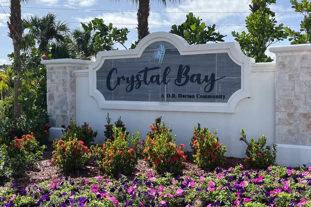 a view of sign board with flowers