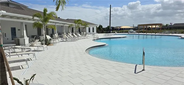 a view of a swimming pool with chairs