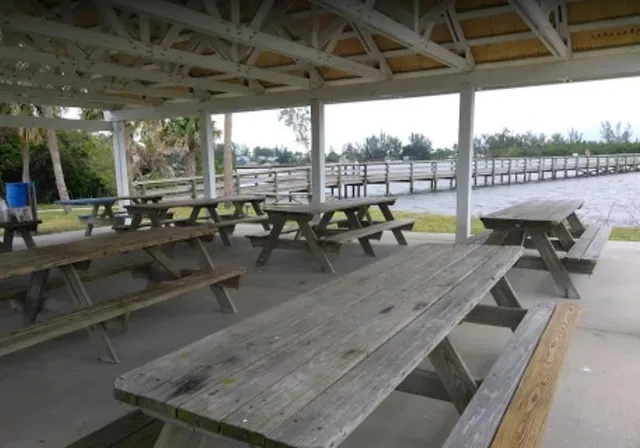 a view of a swimming pool with outdoor seating