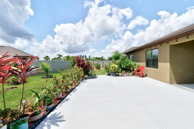 a picture of flowers in front of a building