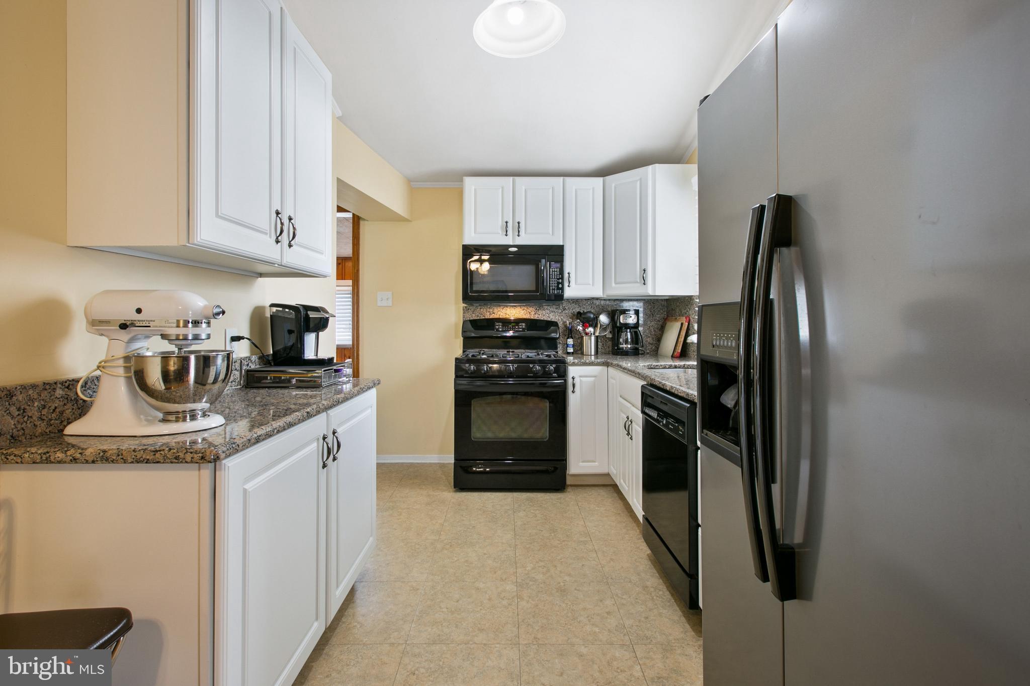 7615 Merritt Point Road Baltimore, MD 21222 - Photo 12 of 42 Updated kitchen with white cabinets