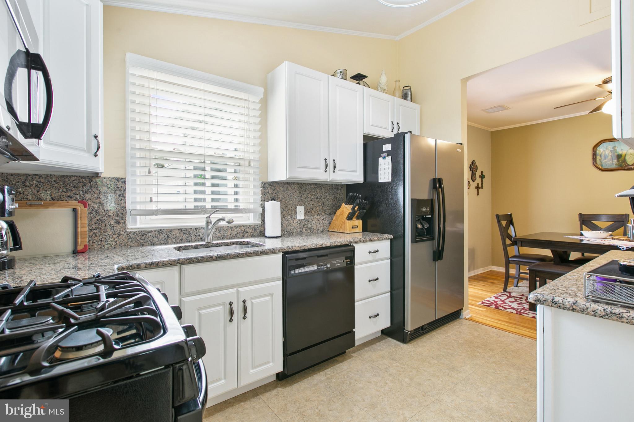 7615 Merritt Point Road Baltimore, MD 21222 - Photo 14 of 42 Granite counters and full granite back splash