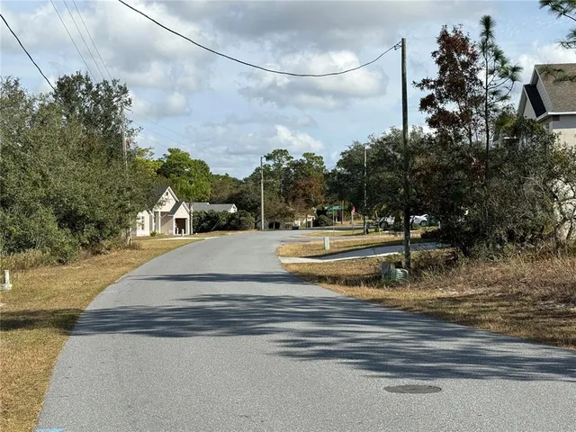 a view of street with houses