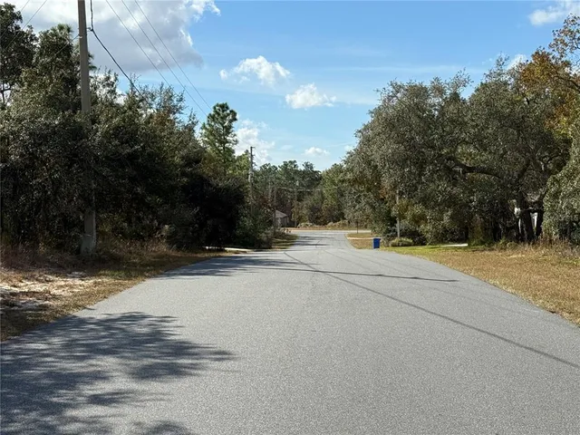 a view of road with trees