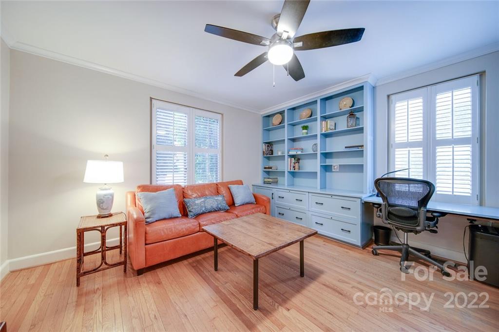 811 Queens Road, Unit 2 Charlotte, NC 28207 - Photo 19 of 31 a living room with furniture lamps and a window