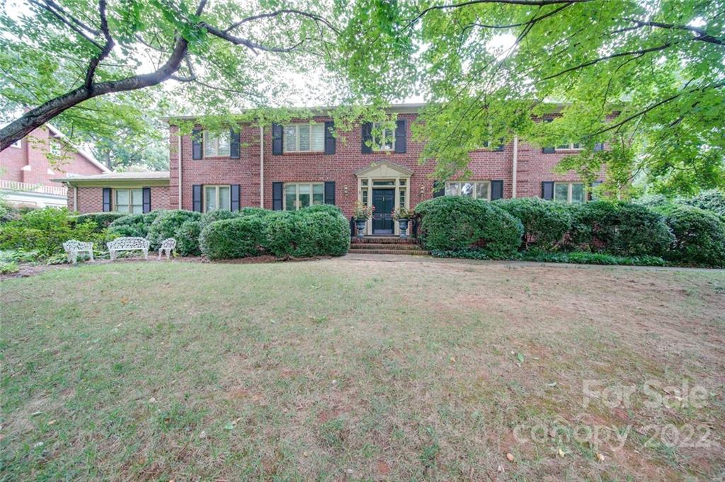 811 Queens Road, Unit 2 Charlotte, NC 28207 - Photo 28 of 31 a view of a brick building next to a big yard