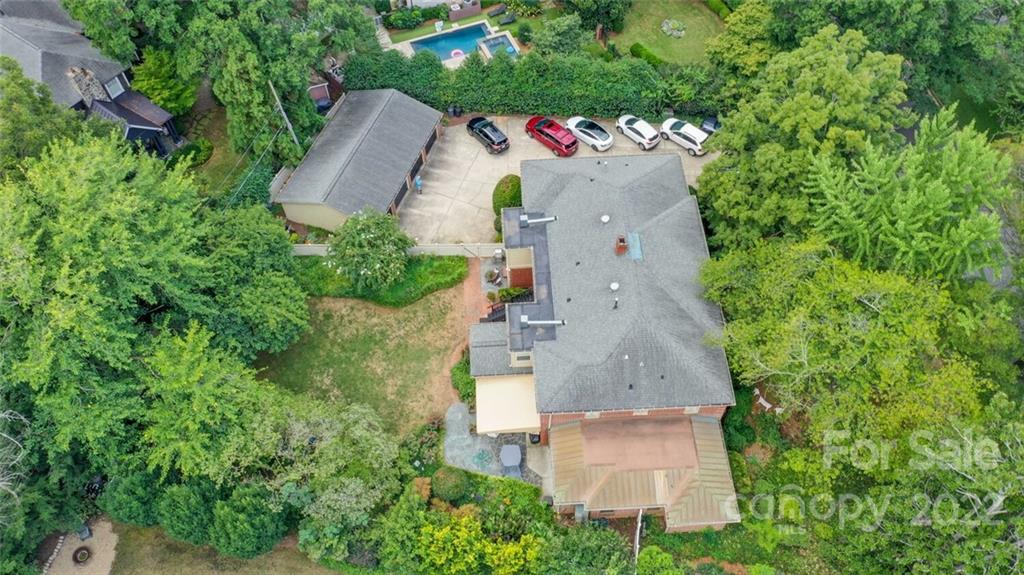 811 Queens Road, Unit 2 Charlotte, NC 28207 - Photo 30 of 31 an aerial view of a house with a yard and trees
