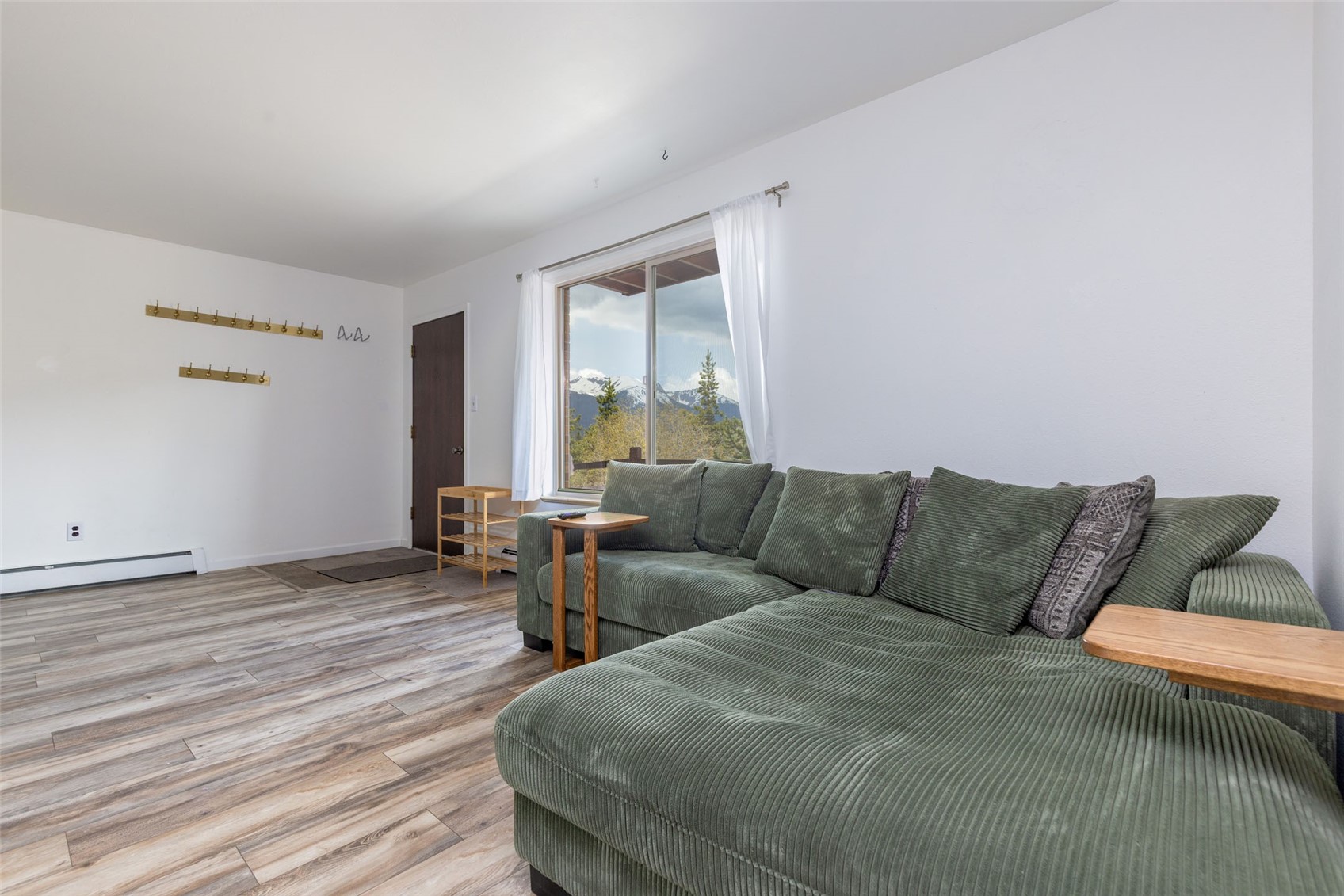 180 Evergreen Road, Unit 105 Dillon, CO 80435 - Photo 5 of 24 a living room with furniture and a large window