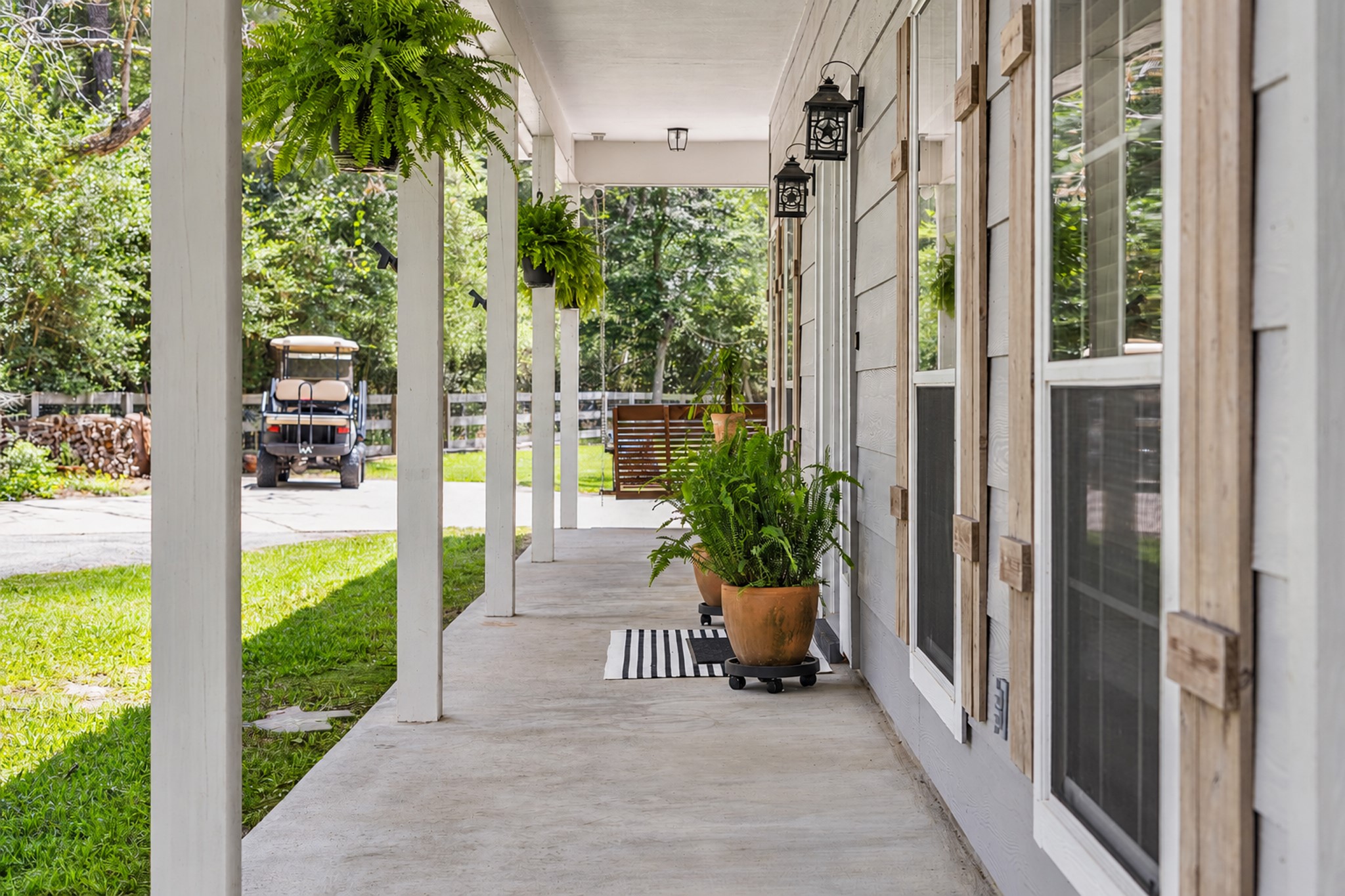 19610 Timber Ridge Drive Magnolia, TX 77355 - Photo 6 of 49 The classic wooden shutters create a cozy, welcoming atmosphere.