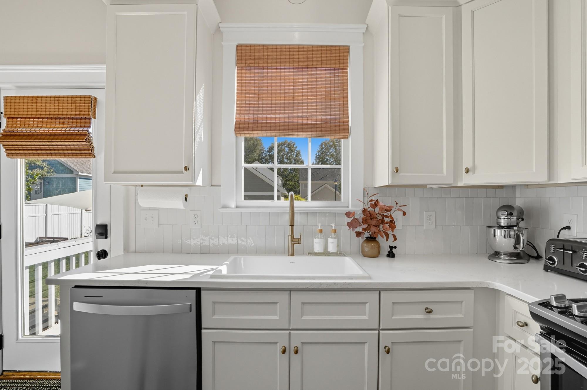 911 Cara Court Fort Mill, SC 29708 - Photo 18 of 48 a kitchen with a sink cabinets and window