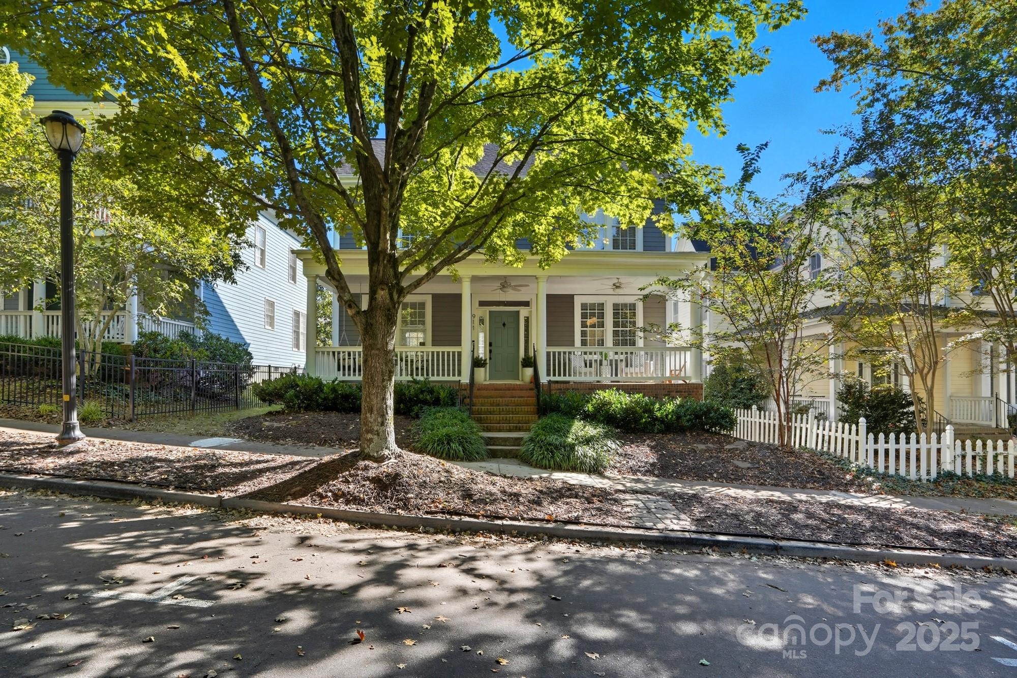 911 Cara Court Fort Mill, SC 29708 - Photo 2 of 48 a view of a yard in front of a house with large tree