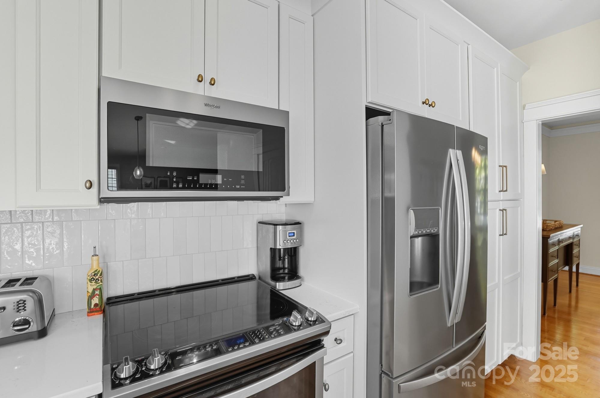 911 Cara Court Fort Mill, SC 29708 - Photo 21 of 48 a kitchen with stainless steel appliances a refrigerator stove and microwave