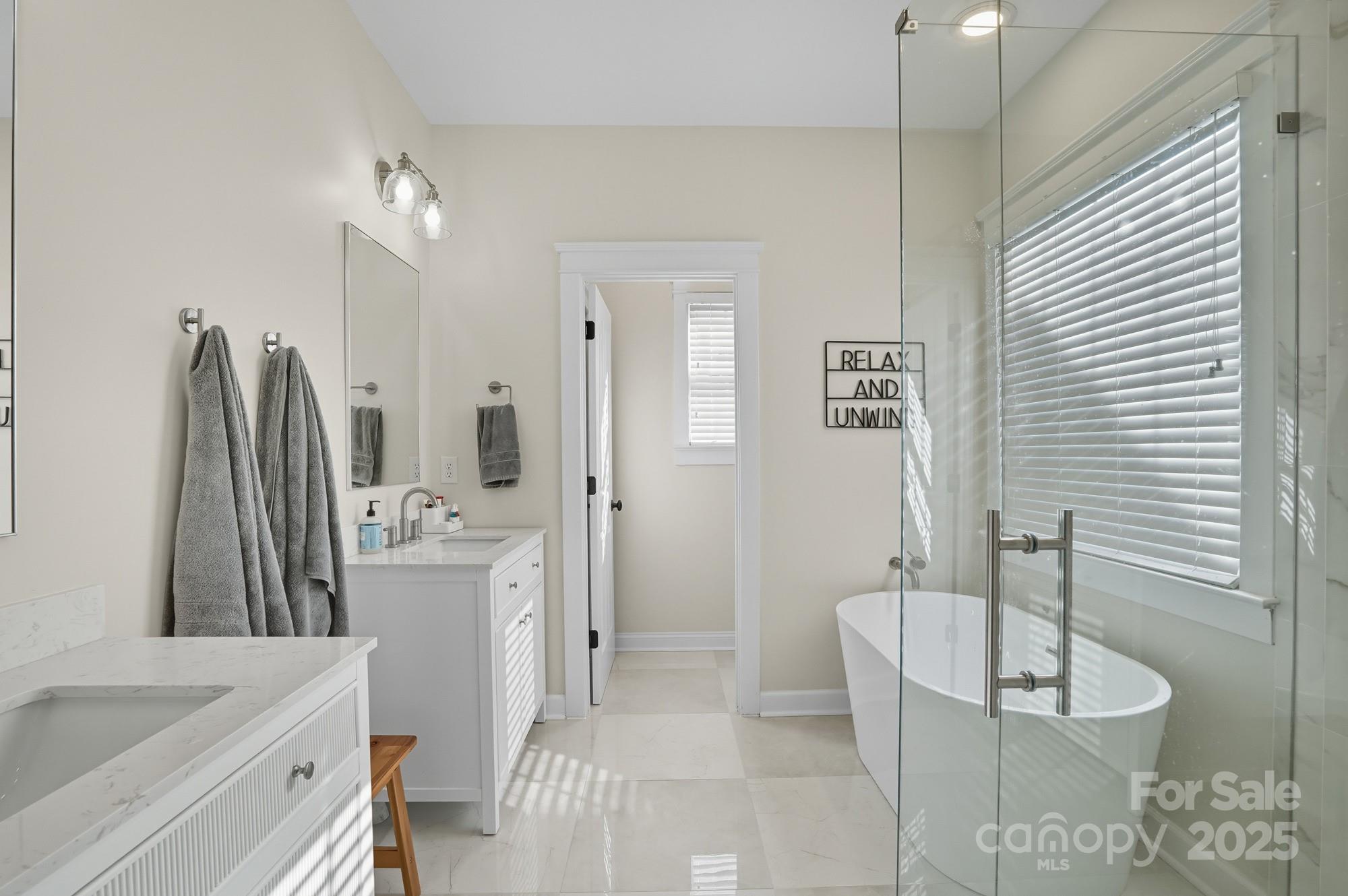 911 Cara Court Fort Mill, SC 29708 - Photo 27 of 48 a bathroom with a tub sink and mirror