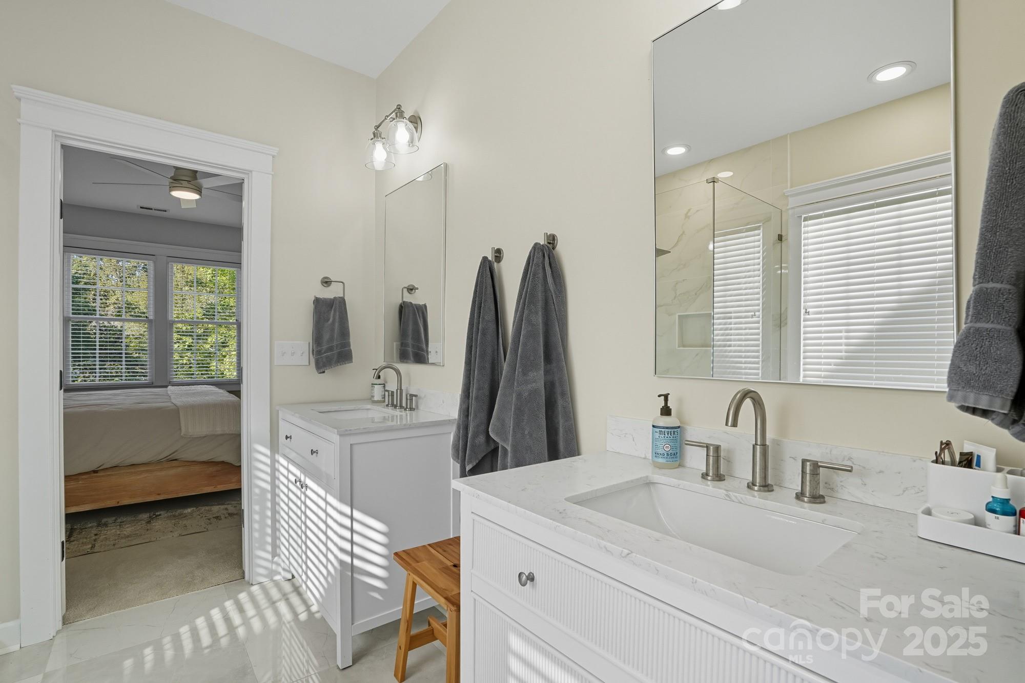 911 Cara Court Fort Mill, SC 29708 - Photo 28 of 48 a bathroom with a sink tub double vanity and mirror