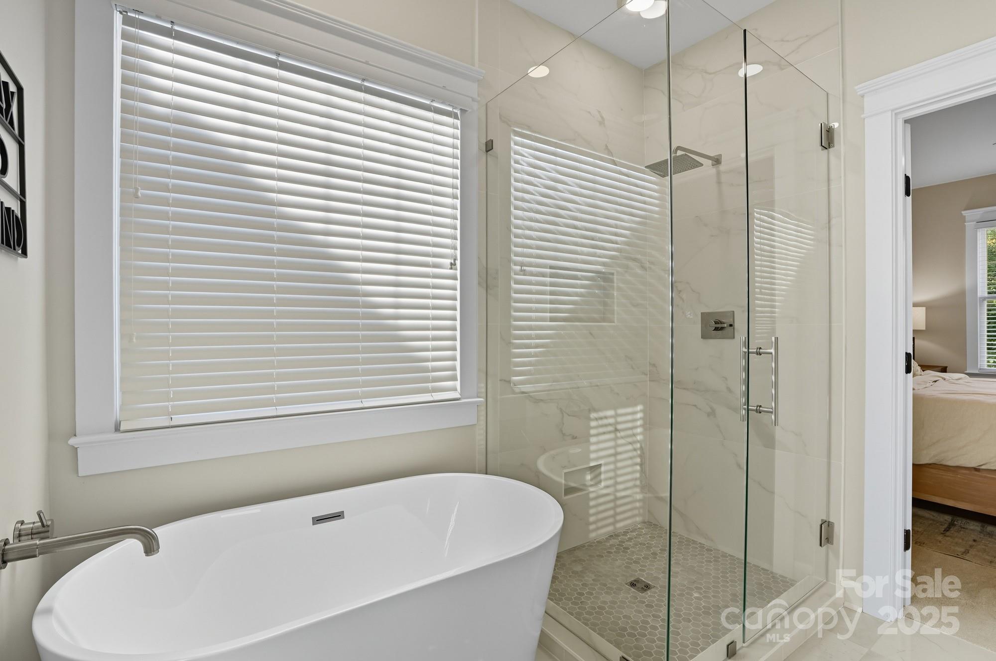 911 Cara Court Fort Mill, SC 29708 - Photo 30 of 48 a bathroom with a bathtub and shower