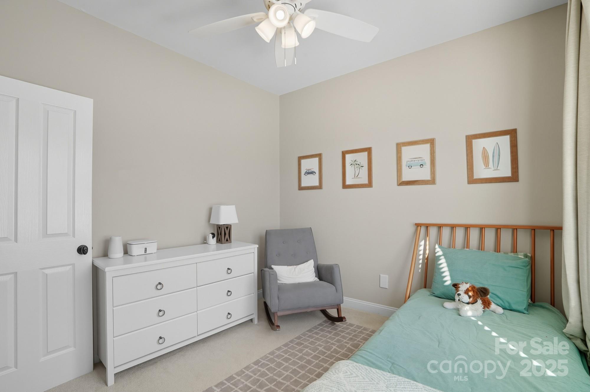 911 Cara Court Fort Mill, SC 29708 - Photo 32 of 48 a bedroom with a bed and a chandelier