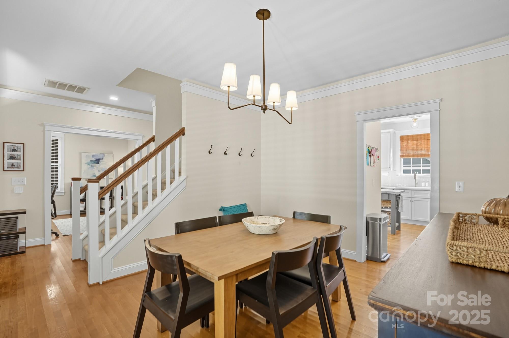 911 Cara Court Fort Mill, SC 29708 - Photo 8 of 48 a view of a dining room with furniture wooden floor and chandelier
