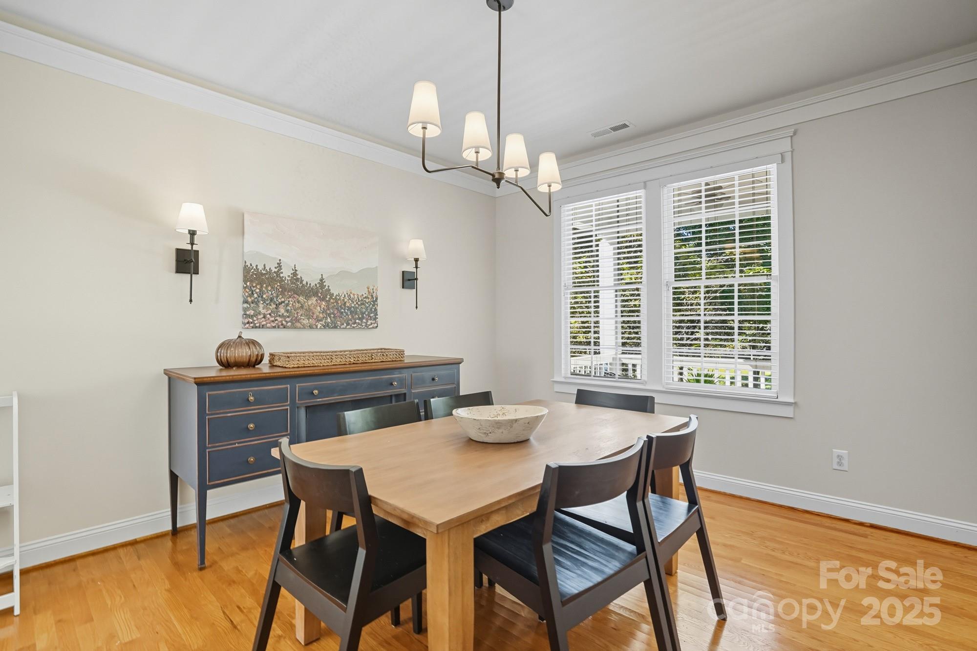 911 Cara Court Fort Mill, SC 29708 - Photo 9 of 48 a view of a dining room with furniture window and wooden floor