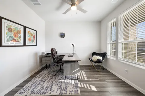 a work room with furniture and a window