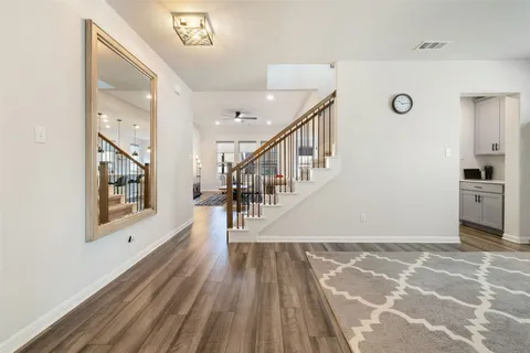a view of an entryway with wooden floor