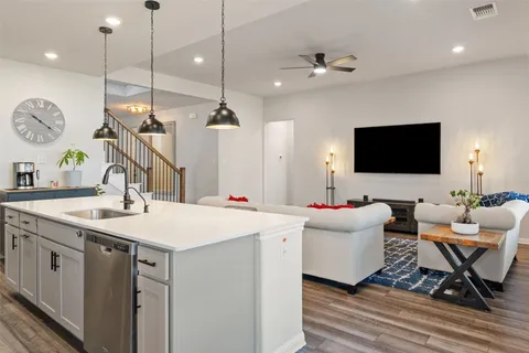 a view of a house with swimming pool and sitting area