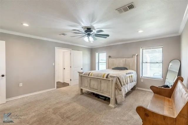 a bed room with a bed and a couch