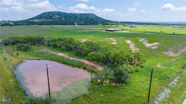 a view of a golf course with a big yard