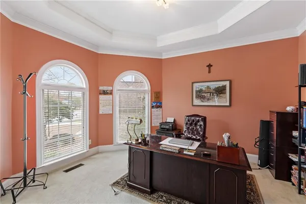 a view of a a dining room with furniture window and wooden floor