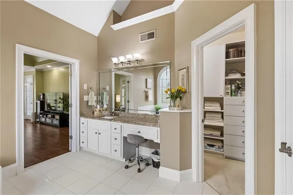 a white bath tub sitting next to a white toilet