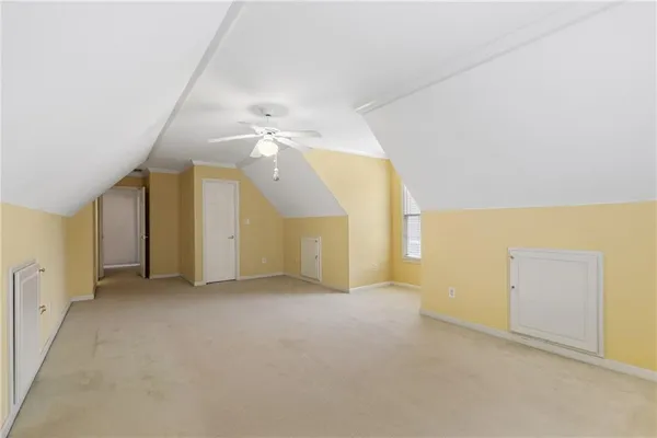 a front view of a building with a yard