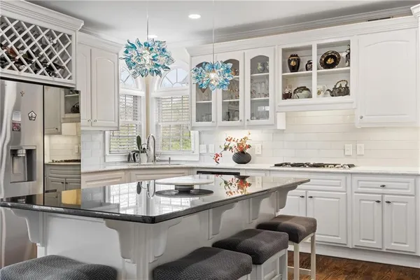 a dining room with furniture and wooden floor