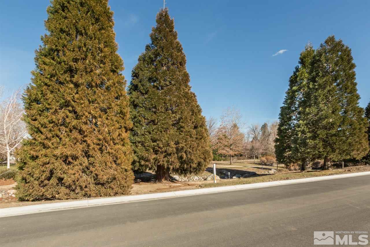 6144 Falabella Way Reno, NV 89511 - Photo 4 of 20 front view of a house with a yard and trees