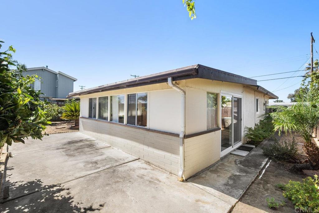 4473 Rolfe Road San Diego, CA 92117 - Photo 13 of 18 a view of a house with backyard