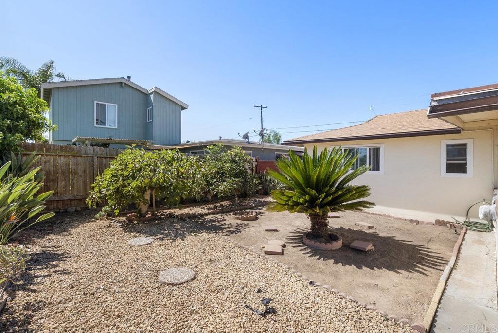 4473 Rolfe Road San Diego, CA 92117 - Photo 14 of 18 a view of a house with a yard