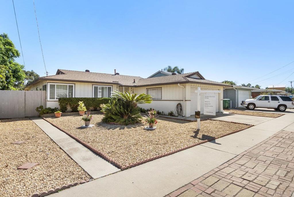 4473 Rolfe Road San Diego, CA 92117 - Photo 17 of 18 a view of a house with backyard and sitting area