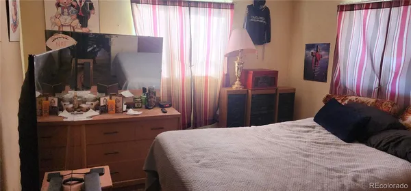 a bedroom with a bed and a closet