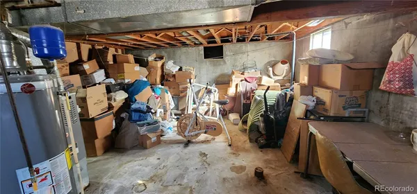 a view of walk in closet with clothes