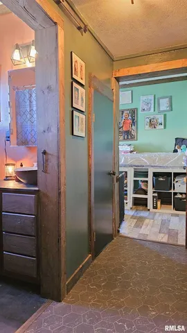 a view of work space with furniture and windows