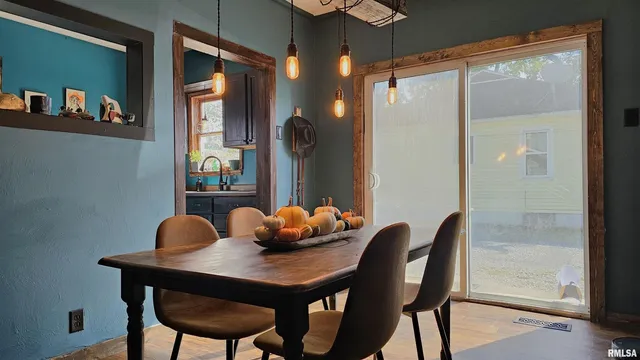 a dining room with furniture and window