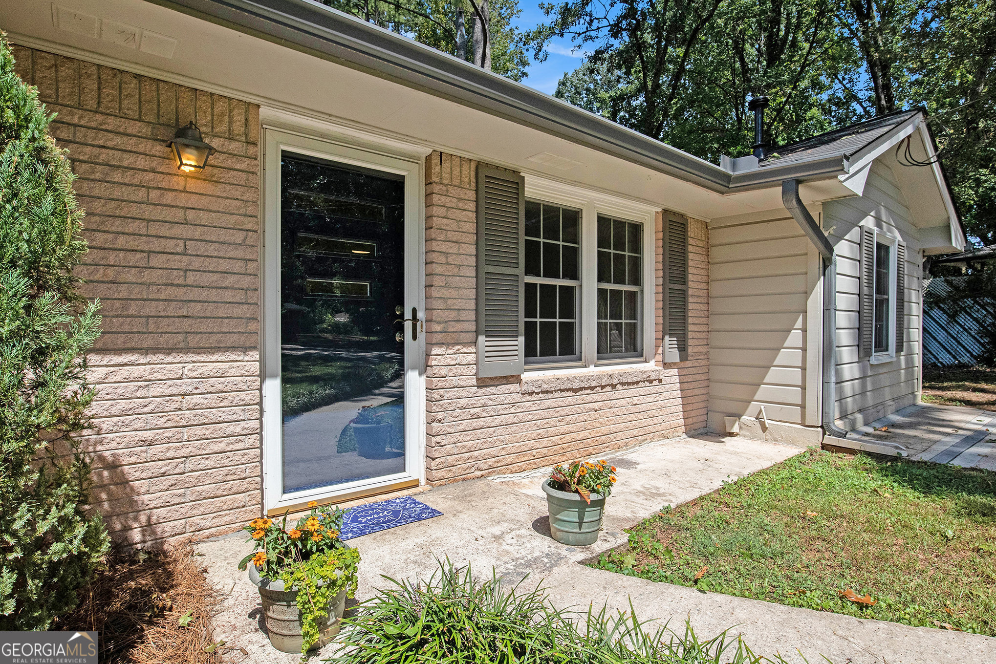 a view of house with yard