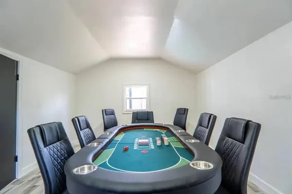 a living room with furniture a rug and a table