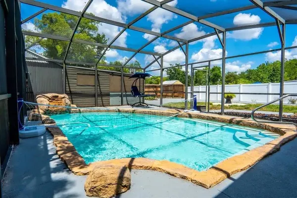 a view of a backyard with sitting area
